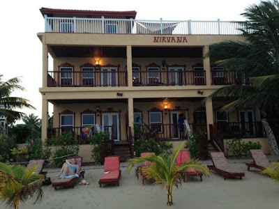 Remax Vip Belize: Beachfront with cushions at Nirvana