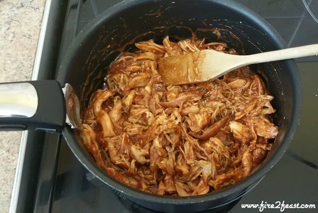 pulled chicken and sauce in a pan