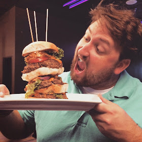 Jay Ducote gets a good look at the Triple Quarters Burger