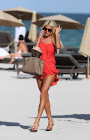 Victoria Silvstedt looking super hot in an orange mini dress