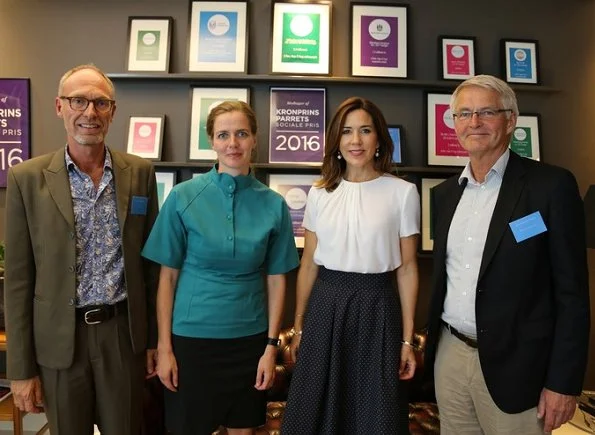 Crown Princess Mary of Denmark attended the opening of a new Grief Center. Princess wore Hugo Boss blouse, blue skirt