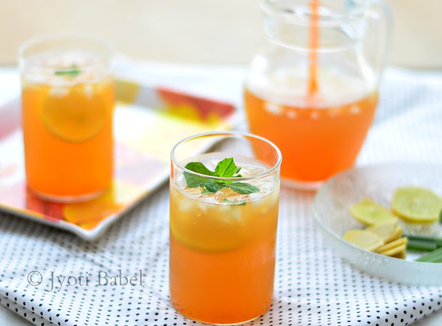 Herbal Ice Tea is a thrist-quenching summer drink. With lemongrass, ginger and mint, this herbal ice tea is full of flavours. Find my Herbal Ice Tea Recipe on www.jyotibabel.com