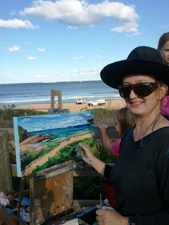 Industrial heritage artist Jane Bennett  painting the ex HMAS Adelaide en plein air on North Avoca Beach