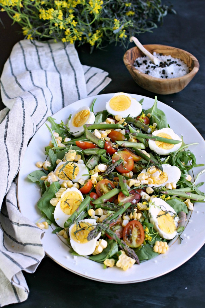 Recipe for a salad with eggs, asparagus, corn and peppery mizuna greens.
