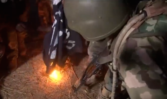 1 Photo of the day: Nigerian soldiers burn Boko Haram black flags