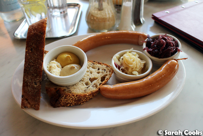 Frankfurters with Sauerkraut, red cabbage, mustard, horseradish and bread