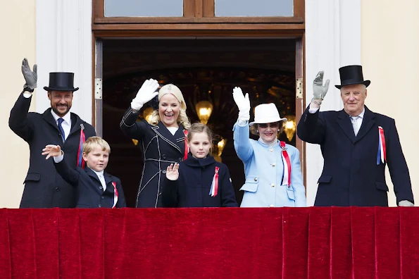 King Harald and Queen Sonja, Crown Prince Haakon of Norway and Crown Princess Mette-Marit of Norway with Princess Ingrid Alexandra, Prince Sverre Magnus and Marius Borg Høiby greet the Childrens Parade on the Skaugum Estate 