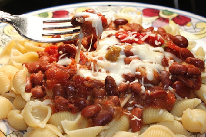 this is chili over pasta and melted cheese
