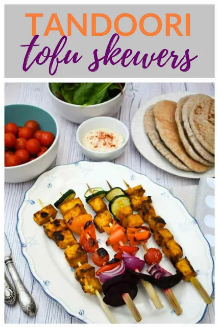 Grilled Tandoori Tofu Skewers. skewers stacked with tandoori marinated tofu and a selection of colourful vegetables. Includes recipe for tandoori marinade. Only 94 calories per skewer. #skewers #tofu #tofuskewers #tofurecipes #veganBBQ #tofurecipes 
