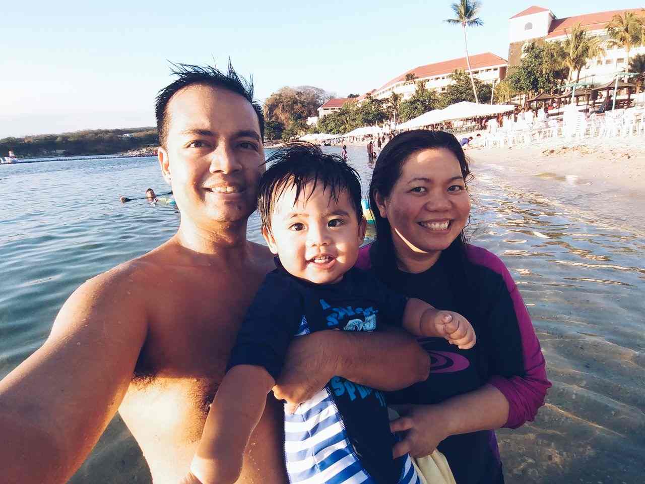 Daddy, Mommy, and Miguel at the beach at Canyon Cove in Batangas