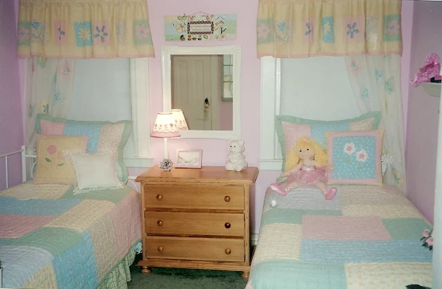 Garden style pink and green girls's bedroom with two beds