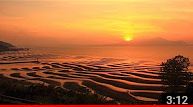 砂紋輝く夕陽の海岸