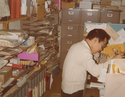 Andy Wong at Work in his Office at Logos of Westwood. 