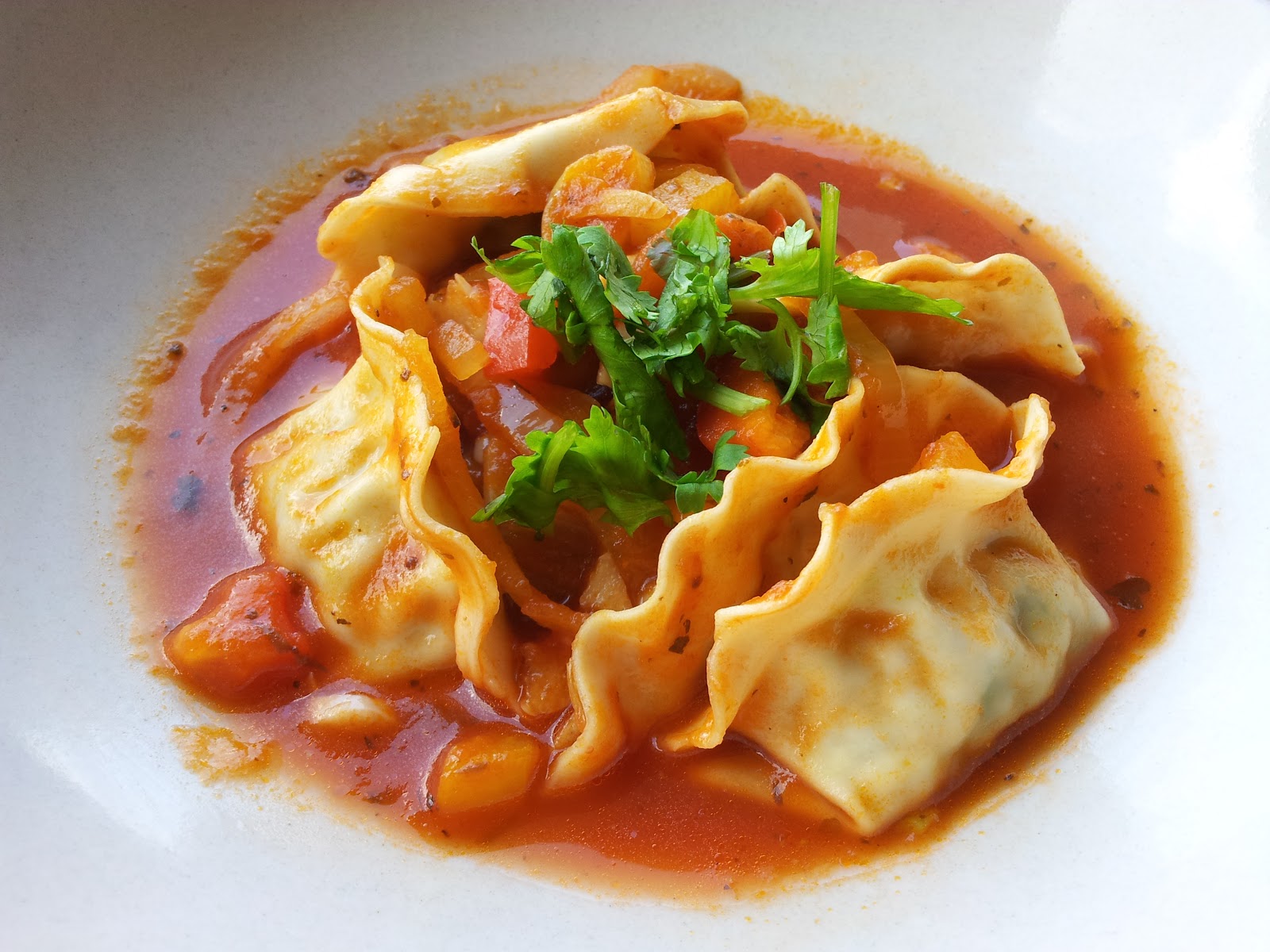 Karlim Photoblog Chinese dumplings with tomatoes pasta sauce，avocado