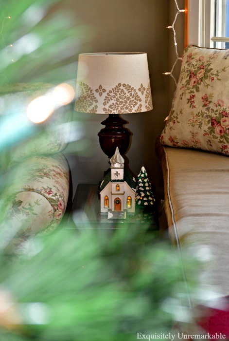 Ceramic Christmas Church lit up in family room 
