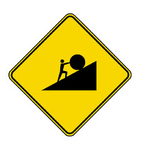 road sign of Sisyphus pushing a boulder up a hill