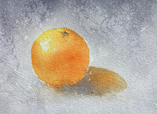 A water color painting of an orange on handmade paper A water color painting of an orange on handmade paper