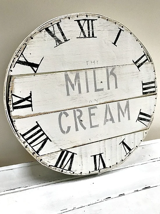 distressed clock face on a vintage cheese box