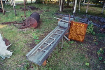 Alaska sluice box display in Tatlanika,Alaska, near Denali National Park. Picture of sluice box with riffles, in rural Alaska on the Parks Highway.
