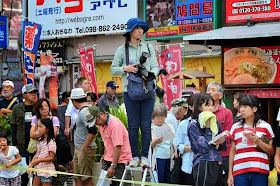 photographer on ladder,parade,Okinawa