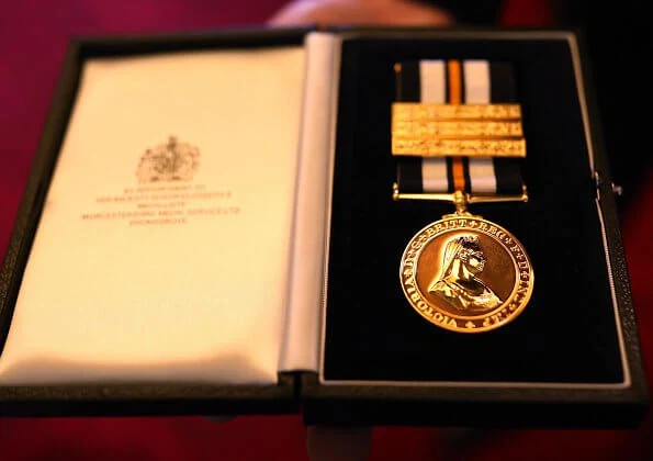 At Buckingham Palace, Lord Prior of the Order of St John, Professor Mark Compton presented the first ever golden medal to the Queen