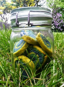 Swirly Rainbow cookies in blue green and yellow in mason kilner jar
