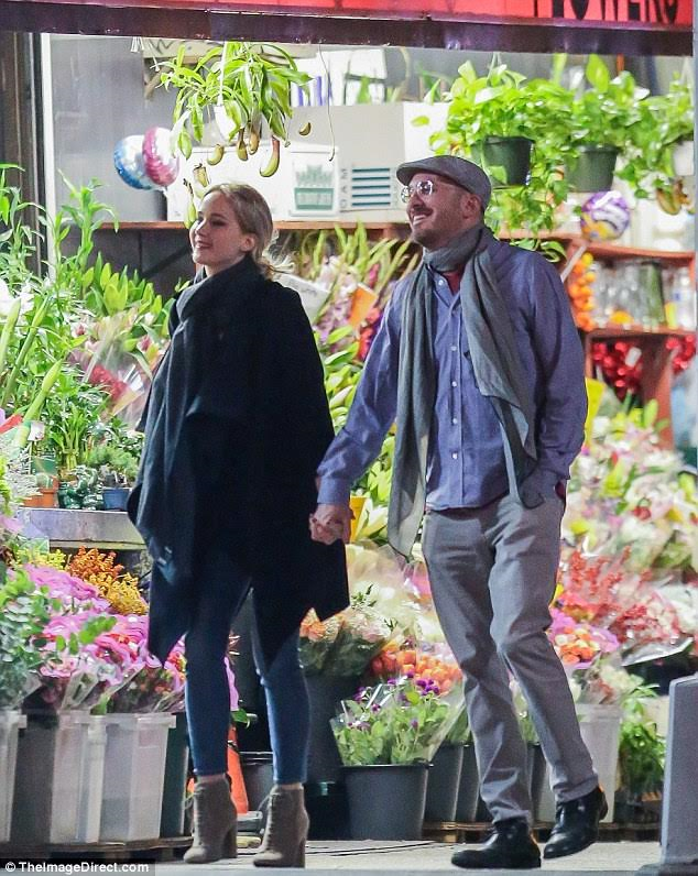 Jennifer Lawrence and director Darren Aronofsky pictured kissing after romantic dinner date in