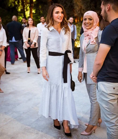Queen Rania of Jordan held an Iftar banquet for Jordanian youth at Basman Palace wore asymmetric belted shirt dress, she carried Louis Vuitton bag
