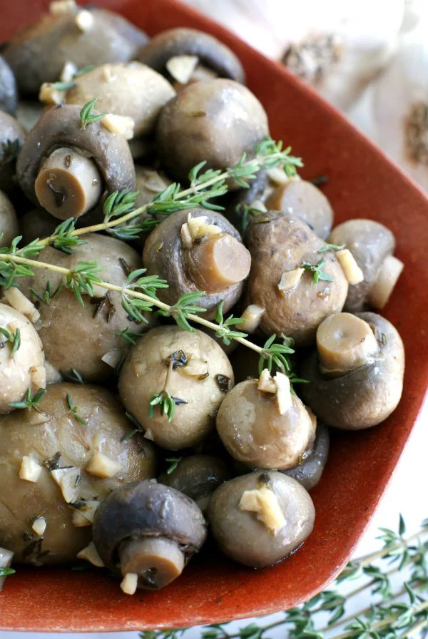 Slow Cooker Garlic Mushrooms are an easy to make, delicious side dish combination of button mushrooms with white wine, garlic, and fresh herbs!