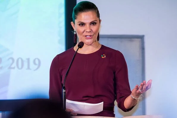 Crown Princess Victoria wore Andiata Kamille trousers and kiana blouse in burgundy, and Odnala wool coat in pink