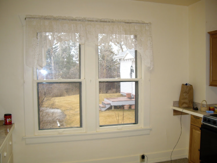 a lovely view from the kitchen: the neighbors house...cozy