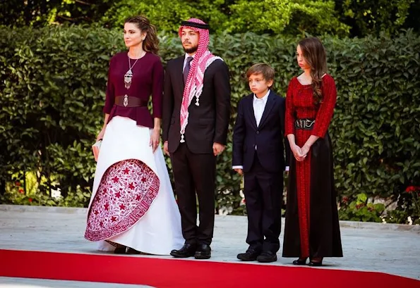 King Abdullah, Queen Rania, Crown Prince Al Hussein, Princess Salma, Prince Hashem attend a ceremony held in Amman for kingdom's 70th Independence Day. Queen Rania dress style, fashions, Valentino dress, Gant dress