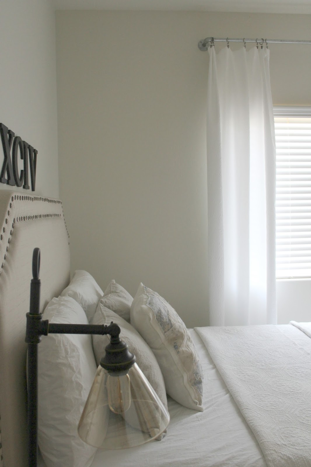 DIY bedroom decor makeover with serene, European inspired modern farmhouse style by Hello Lovely Studio