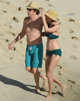 In an aqua trunks, Paul McCartney, 73, accompanied his beautiful 5 years lover, Nancy Shevell, 56, for walking in a green bikini as The couple seemed very enjoy the St Barts situation of beach on Sunday afternoon, December 27, 2015.