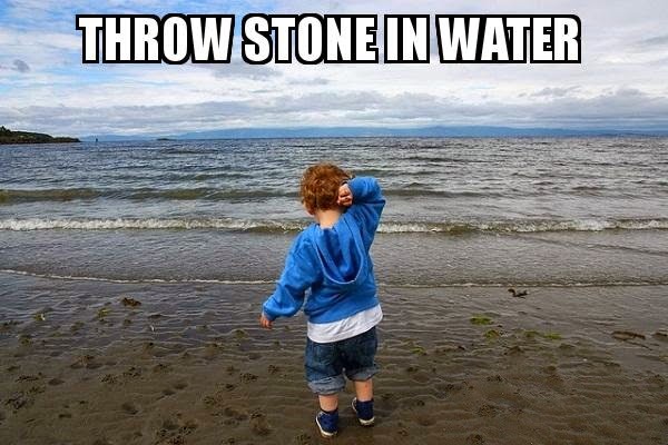kid throwing stone in water