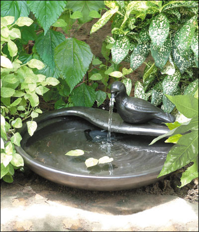 Kate Campbell S Word Garden Sun Splash Solar Fountains In The Also Solarrific White String Lights Can Brighten The Garden Scene Cheerful Essence Of This Outdoor Décor Eliminates Extension Cord Mess And Danger