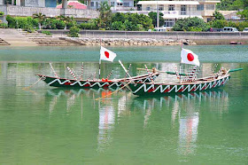 sabani boats, Japanese flags, oars, reflecting in water