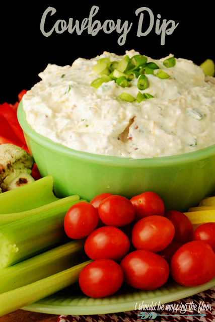 This Cowboy Dip is the perfect game day party food for your gathering.  It has a fun kick to it that makes it irresistible. It's perfect with cut veggies or chips.