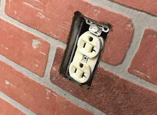 outlet in brick wall
