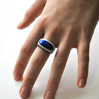 layered paper ring shown on hand