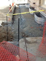 Water main trench and lower level windows Water main trench and lower level windows