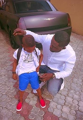 c Fasion designer Yomi Casual shows off his cute son...