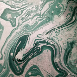 A less impressive example of paper marbling from "The world's worst marbled papers."