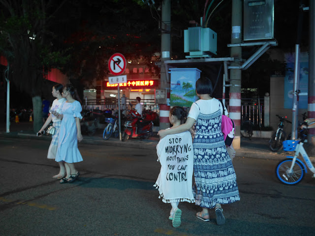 girl wearing a "Stop worrying about things you cant contrl" dress