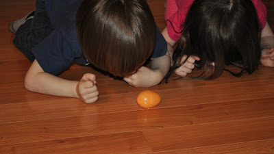 Build gross motor skills by having egg races with plastic eggs
