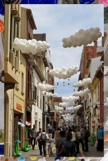 Balloon Clouds over the streets of Palafrugell in Costa Brava, Spain