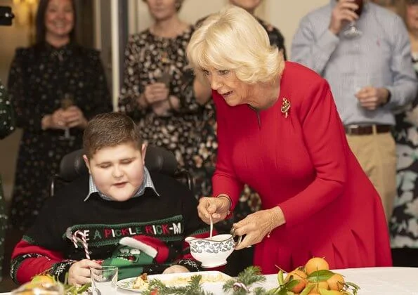The Duchess of Cornwall is the patron of Helen and Douglas House and Roald Dahl Charity. red dress