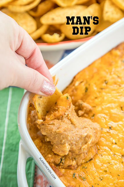 Man's Dip - creamy Mexican bean dip with a kick. Starts with canned bean dip. Add cream cheese, sour cream, taco seasoning, hot sauce and cheese. This was one of the first things to go at our party! Everyone asked for the recipe. #partyfood #beandip #dip