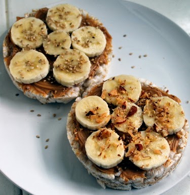 Peanut butter, honey, and banana rice cakes with toasted sesame seeds ...