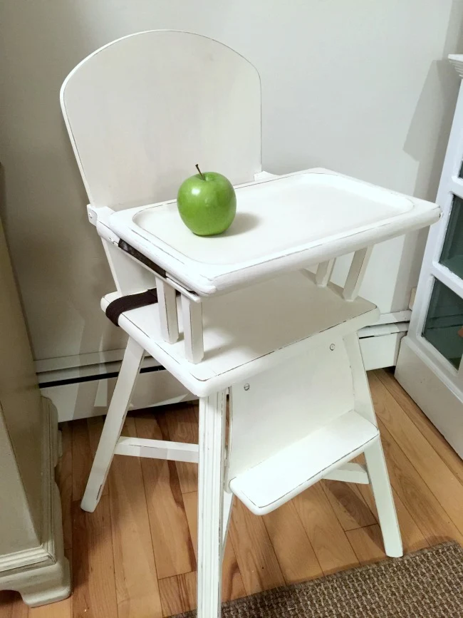 White Painted Vintage Baby Highchair and green apple